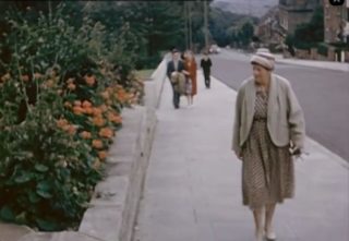 Film still of woman in the street from Beauty in the Borough