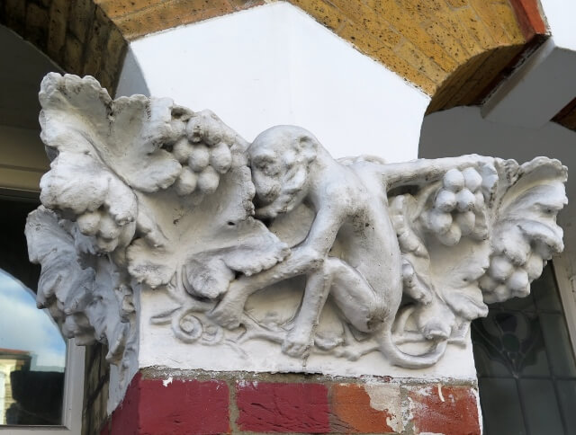 External plasterwork monkey figure in Crouch End