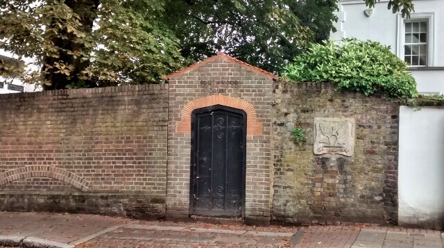 'The Flying Spur' plaque in the boundary wall of the former Southwood Court