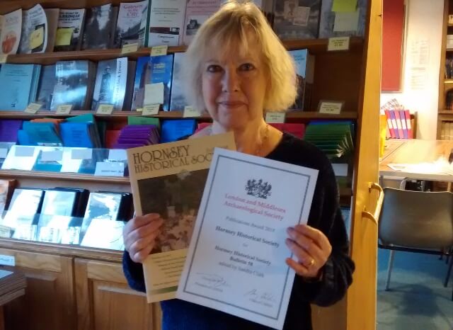Sandra Clark, Bulletin Editor receiving the award